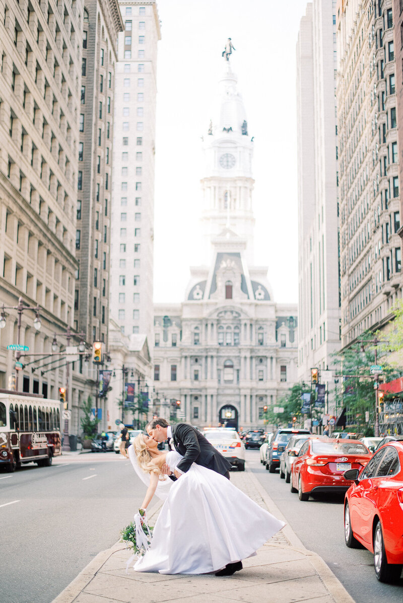 Bride and groom share a few intimate moments on Broad Street captured by NJ Wedding Photographers | Michelle Behre Photography
