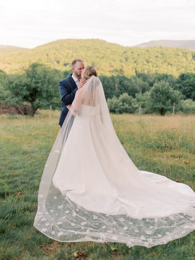 Bride and groom kiss Sunapee New Hampshire wedding