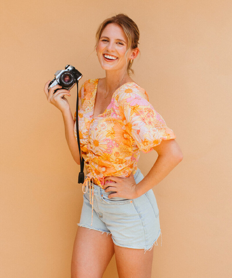 Erin with floral shirt in camera