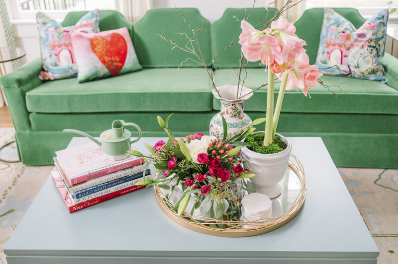 light blue coffee table with pink and green props