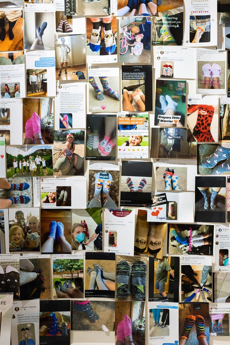 Wall of new sock photos found in Rose Injectables  in honor of daughter, Capri