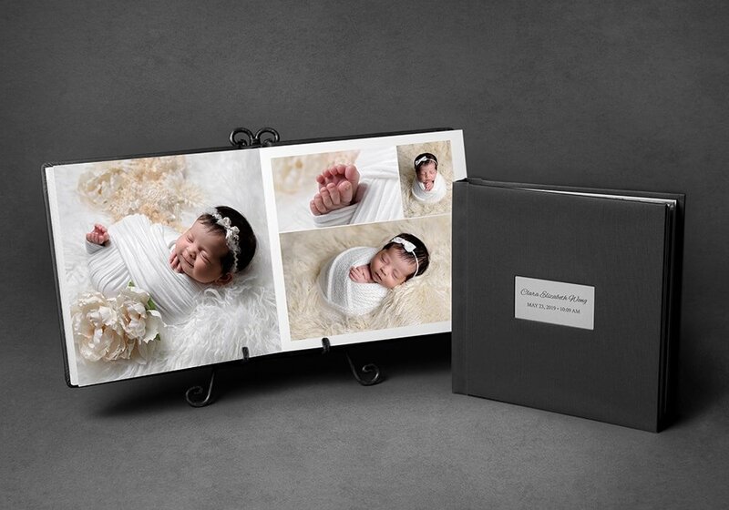 Custom made albums featuring newborn photos by Vancouver Newborn Photographer Amber Theresa Photography.