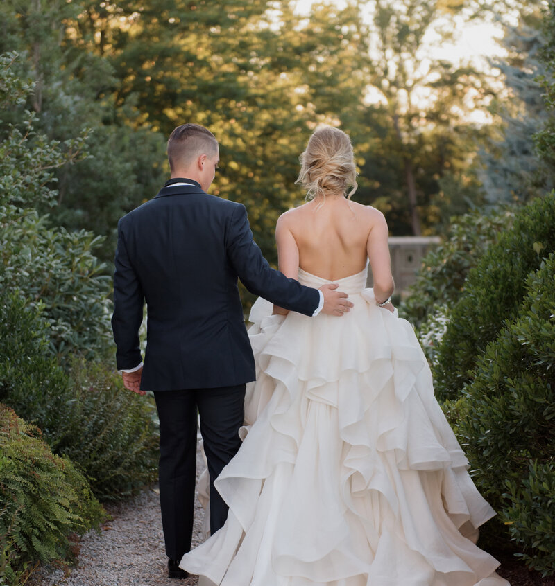 a luxurious wedding at crane estate with bride wearing stunning layered ballgown and soft updo.