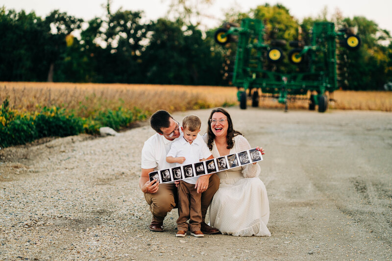 Mom, Dad and Big brother announcing their pregnancy with a second baby at a farm in Stoughton, WI. 