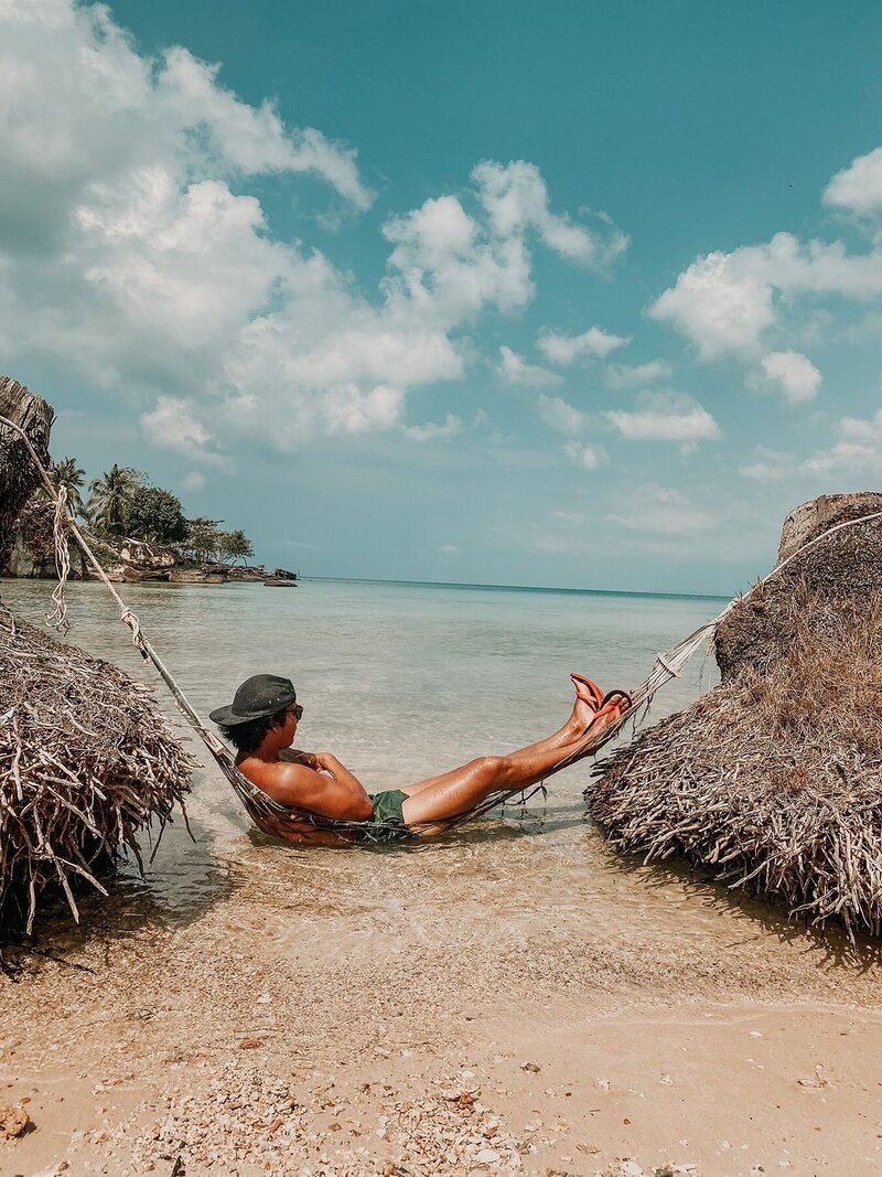 Personal Trainer hanging on fence