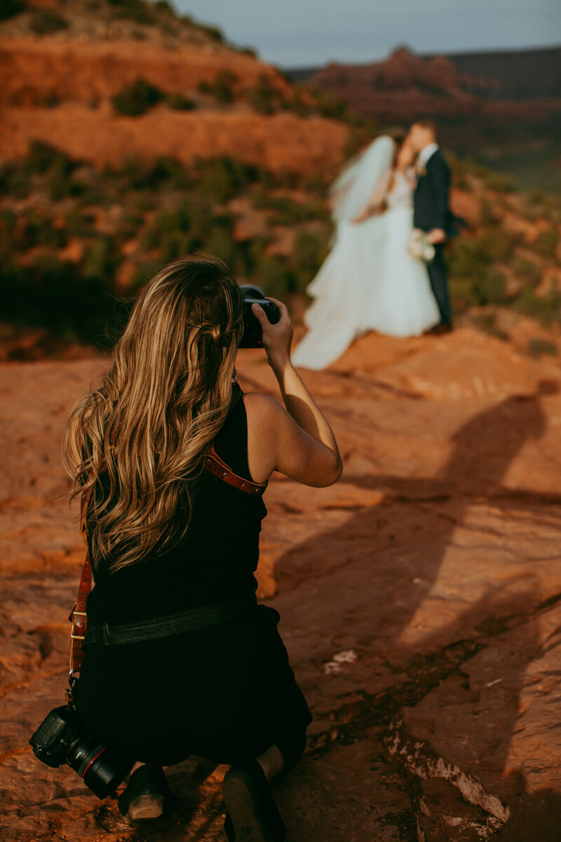 Wedding photographer taking photos of couple in Sedona