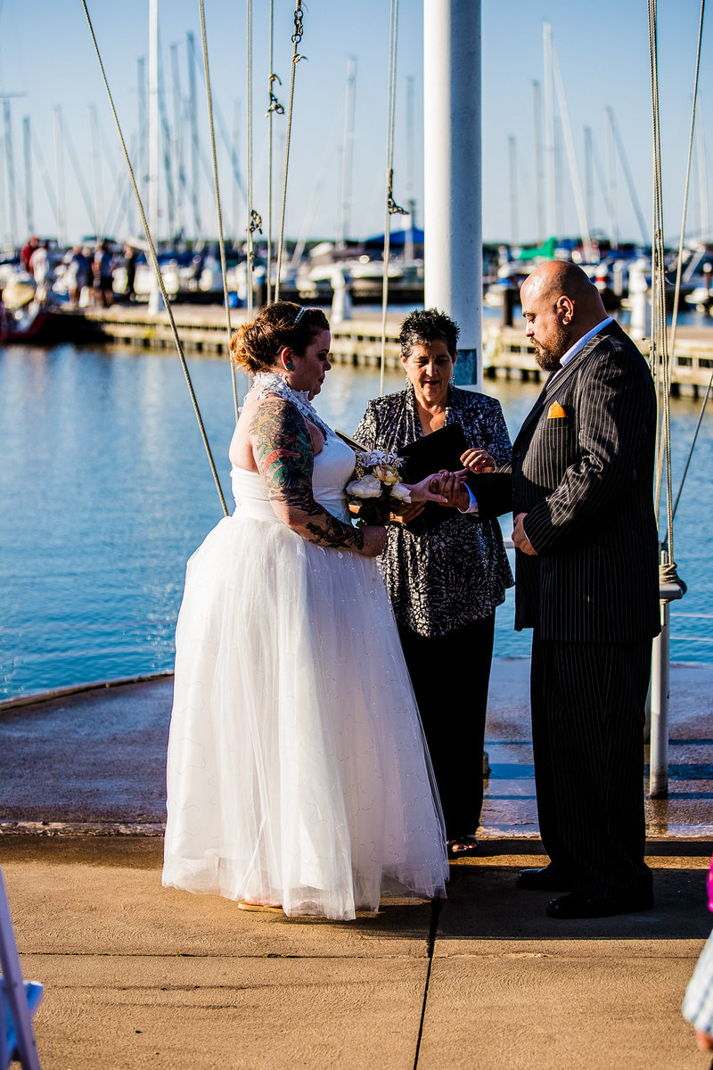 Couple exchanging rings at an Erie Yacht Club wedding