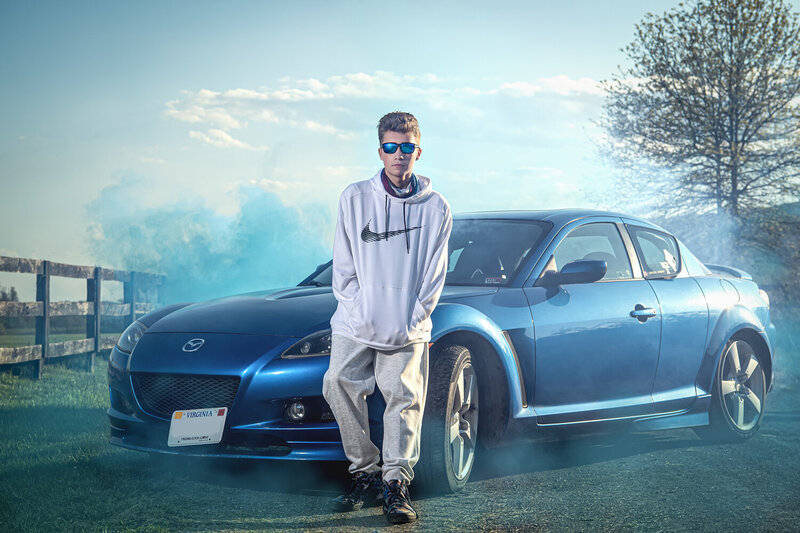smoke bombs with blue mazda and senior guy with glasses