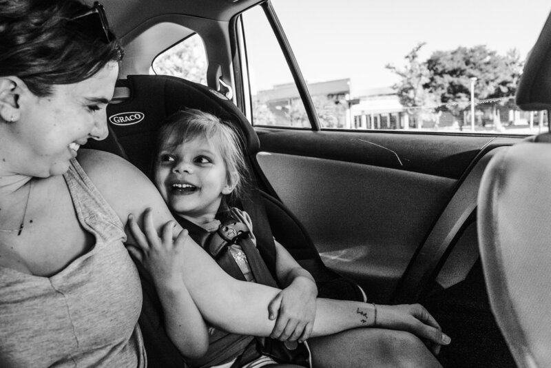 Image of Denver Family Photographer Rachel Greiman in car with her daughter
