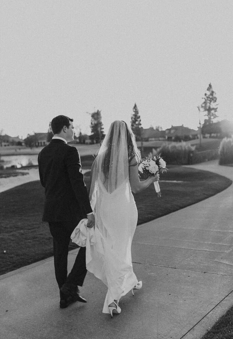 Bride and Groom walking together at wedding venue