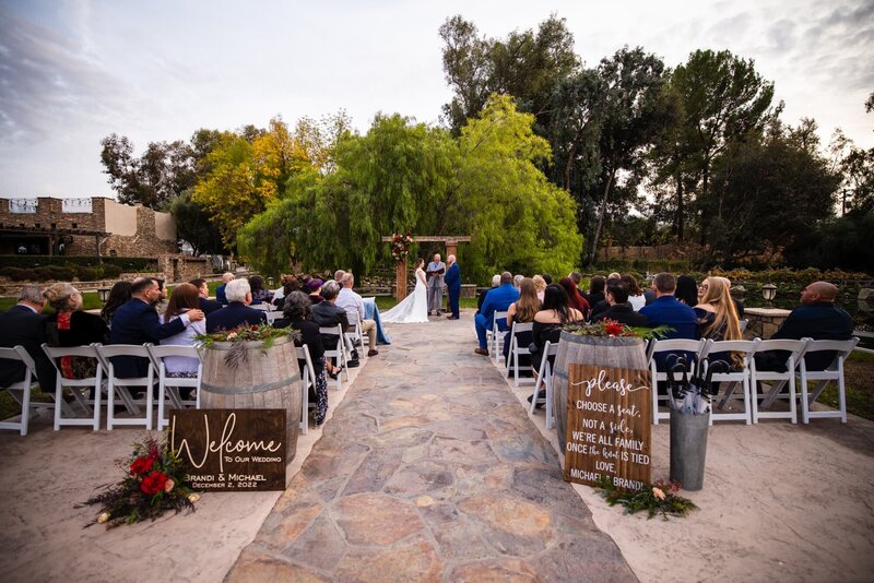 Wedding ceremony setup with guests and bride and groom at Lake Oak Meadows venue in Temecula.