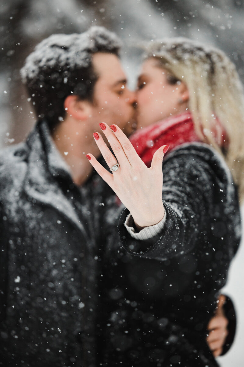 newly engaged couple does session with banff proposal photographer. Beautiful new engagement ring captured in winter engagement session