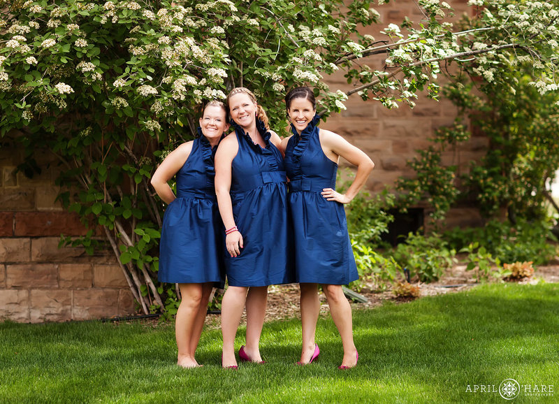 Cute bridesmaids candid picture with the blooming gardens at Avery House