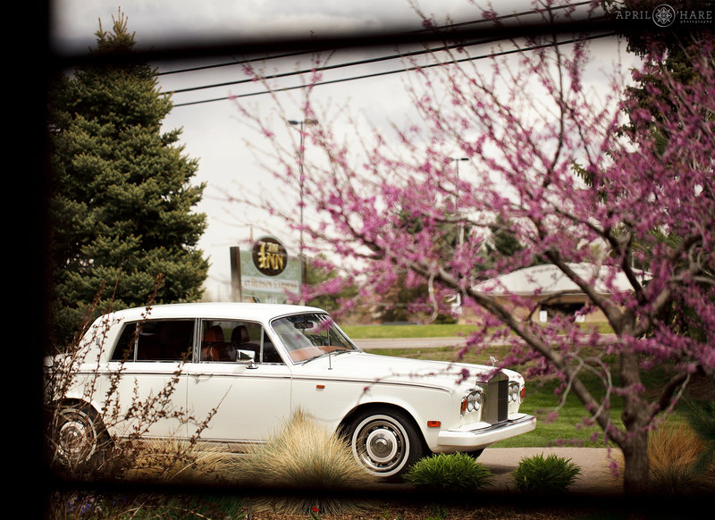 Fancy Rolls Royce waits at  a Spring wedding at the Inn at Hudson Gardens