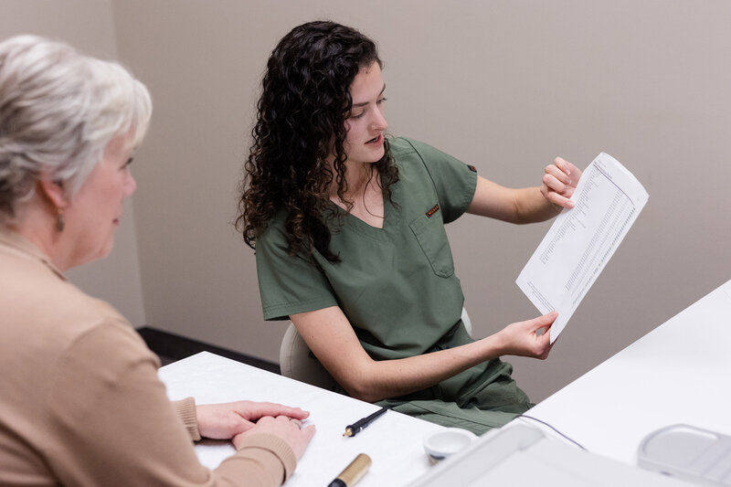 Grace going over bioscan results with a client