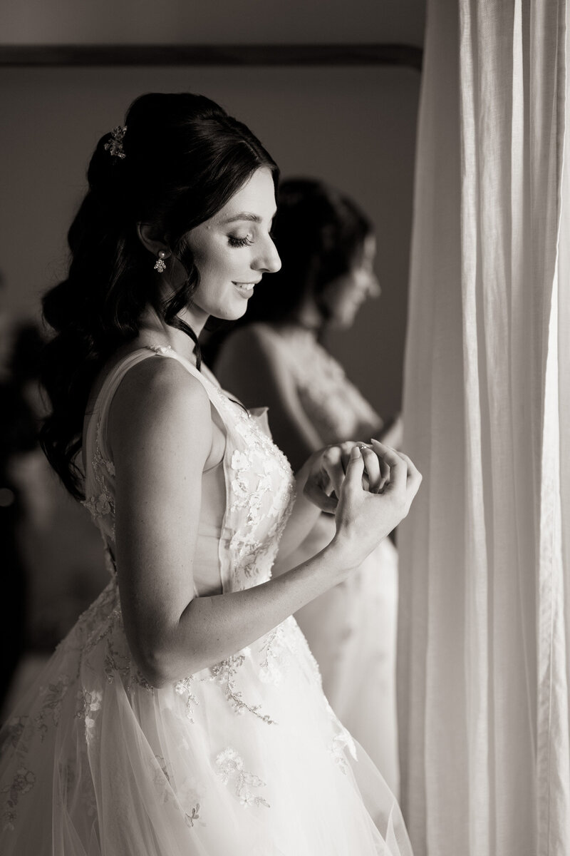 Bride looking at the wedding ring on her hand