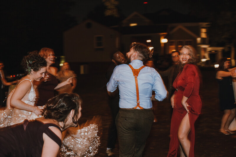 groom dancing with crowd