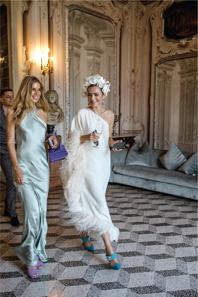bride-and-bridesmaid-walking-in-luxurious-room