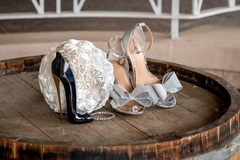 Wedding shoes, jewelry, and perfume styled for wedding morning details – photographed by wedding photographer Niko Coric – Lumen Clarity Media