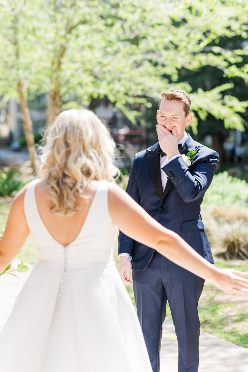 groom's reaction to seeing his bride during first look in Falls park