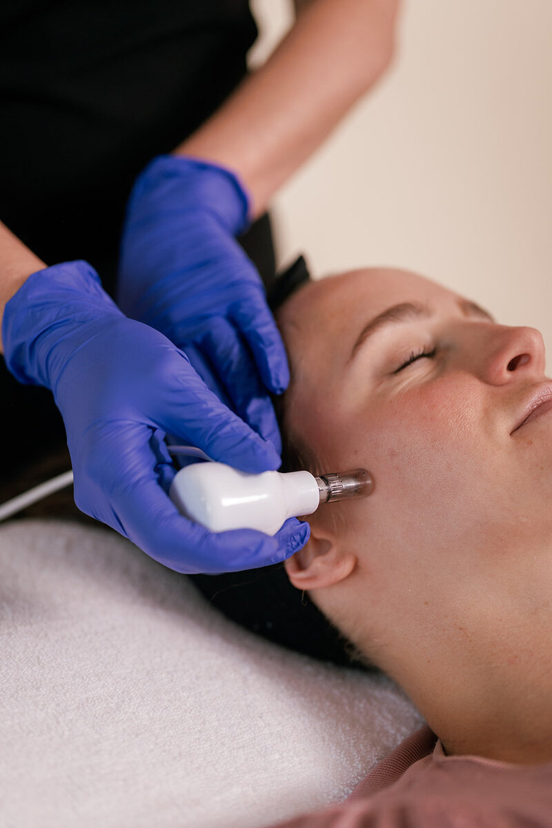 Woman receiving facial treatment at Zula Modern Medspa