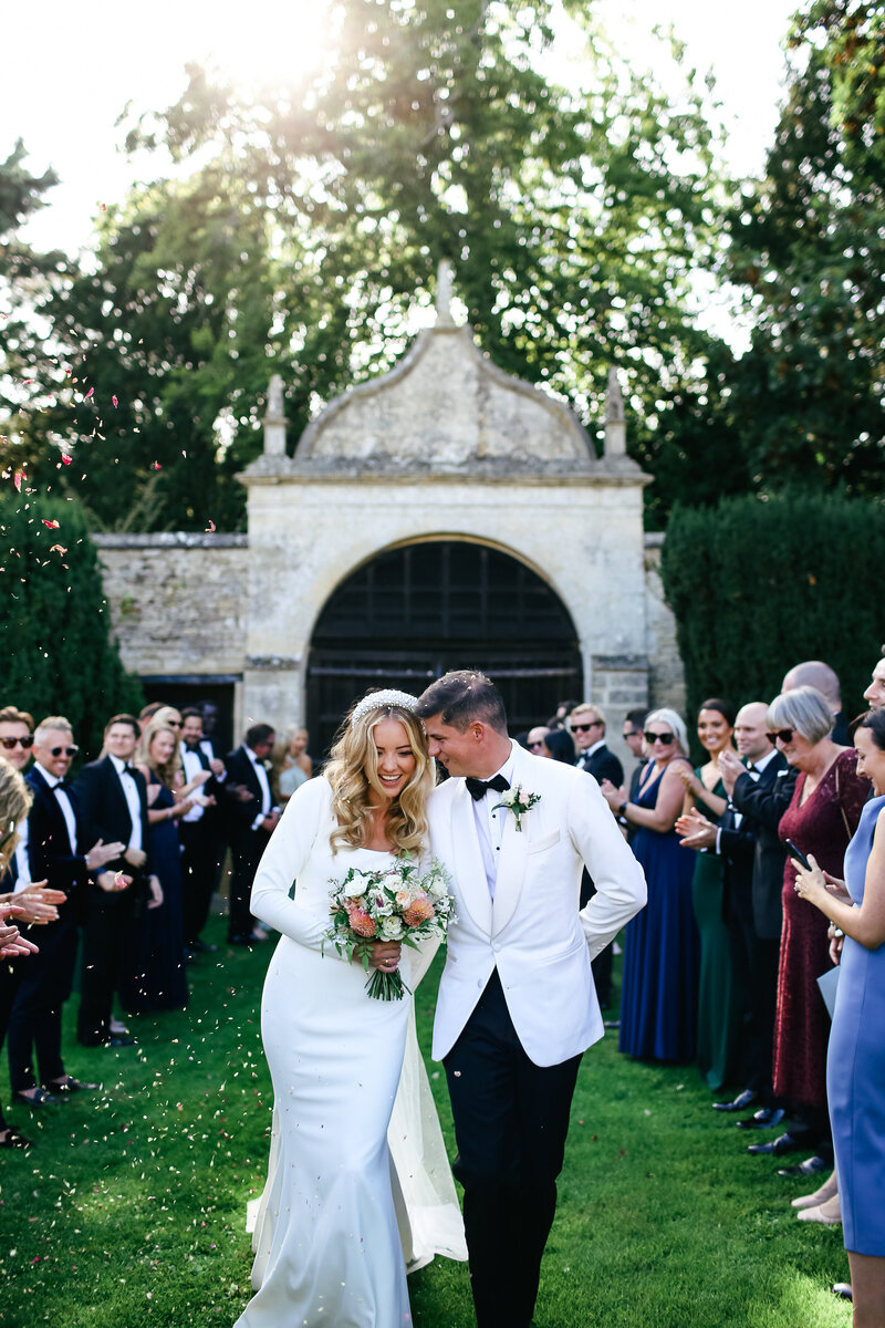 bride-and-groom-walking-at-luxury-wedding-in-oxfordshire
