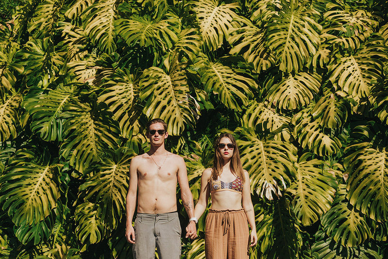 Tropical leaves and cool couple