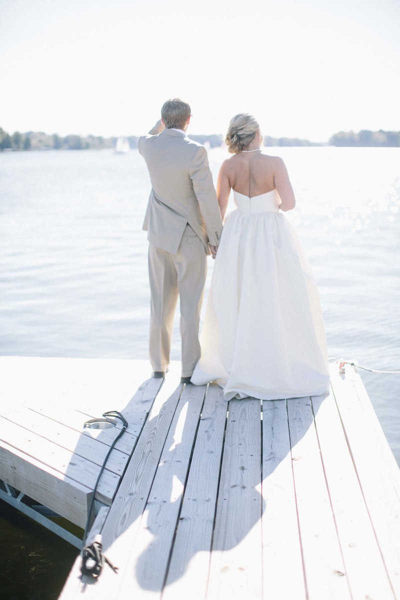 Lake Wawasee wedding couple on a pier in Syracuse indiana