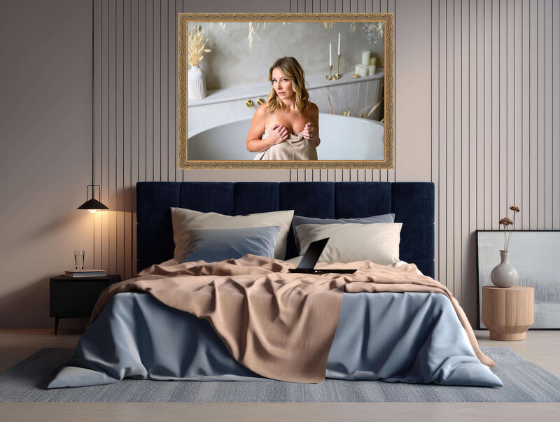 Blue and beige bedroom with a framed gold Toronto boudoir photo