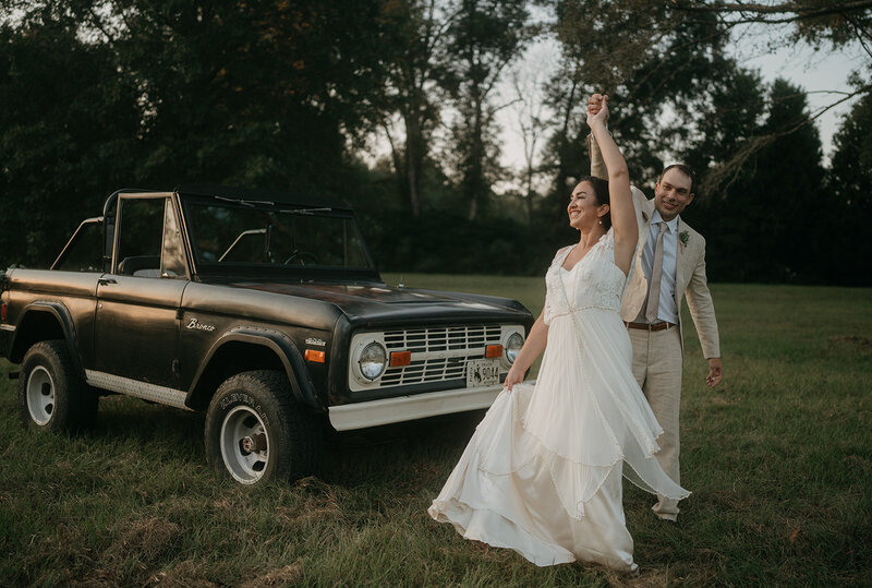 bride and groom with vintage ford bronco
