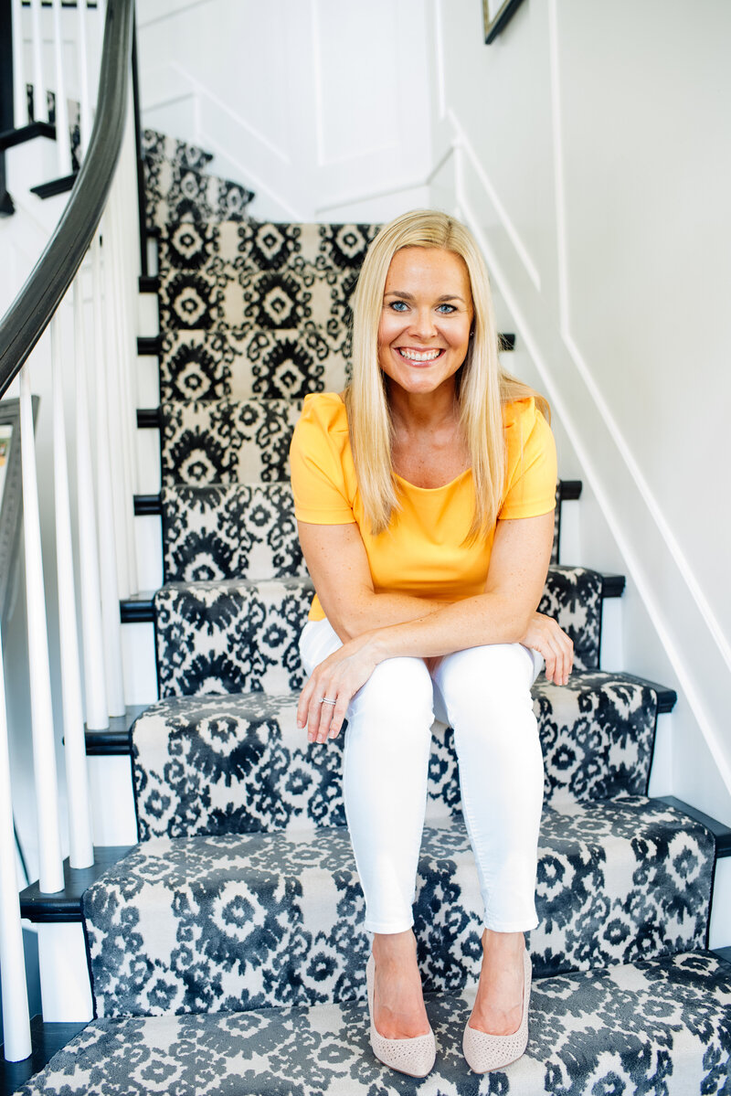 MS nutritionist Alene Brennan sitting on black and white patterned stairs