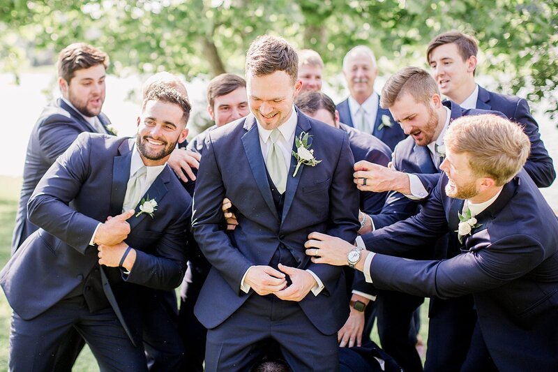 groomsmen tickling groom by Knoxville Wedding Photographer, Amanda May Photos