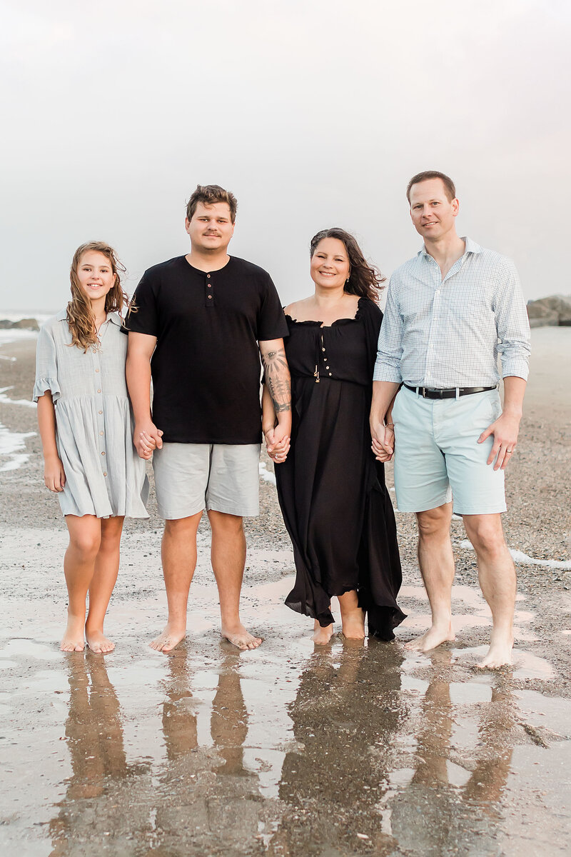 family standing by the ocean in Floirda