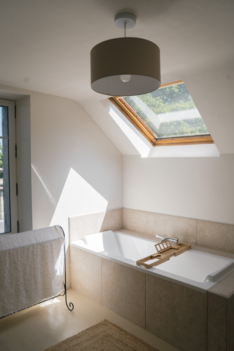 A luxury bathtub with a skylight view.