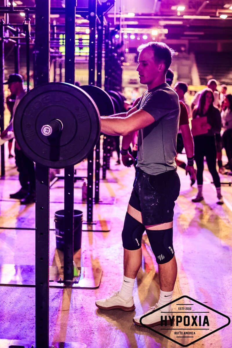 Personal trainer tying shoe