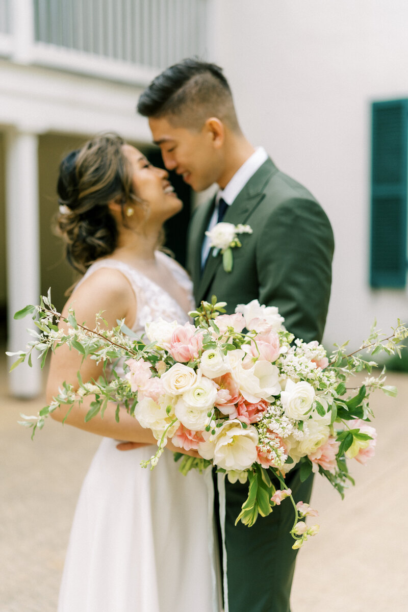 bride and groom with spring bouquet
