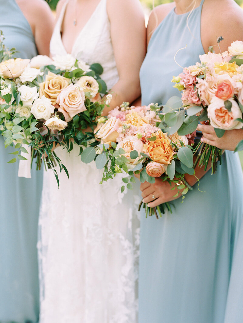 Blue and Peach Bridesmaids with Bouquets