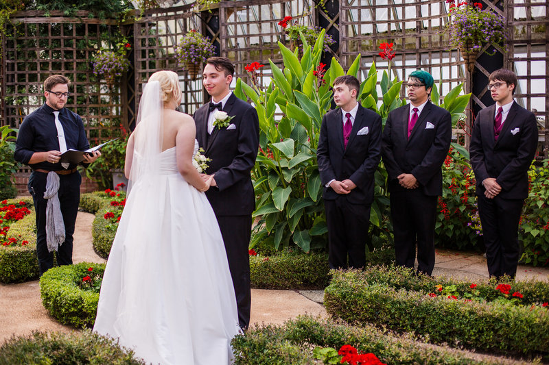 Bride and groom exchange vows at Phipps Conservatory wedding