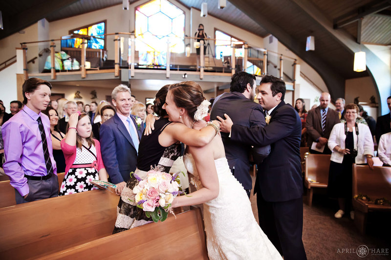 Bride and groom release their guests from St. Mary's individually after their Catholic wedding ceremony at St. Mary's in Breckenridge