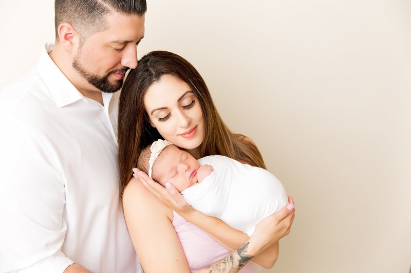Family pose with newborn