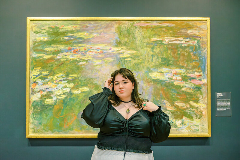 Senior portraits at the Art Institute of Chicago in front of a water lily painting by Claude Monet. Portrait by Chicago senior photographer Kristen Hazelton