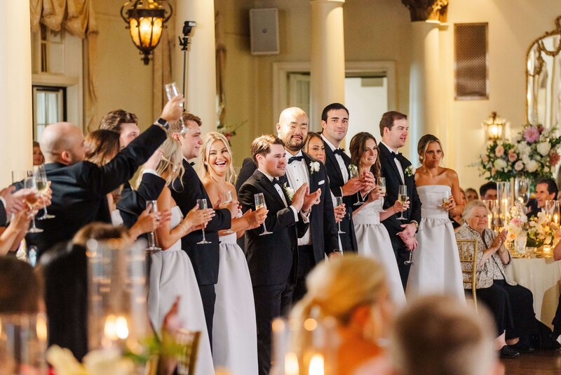 wedding party toasting bride and groom