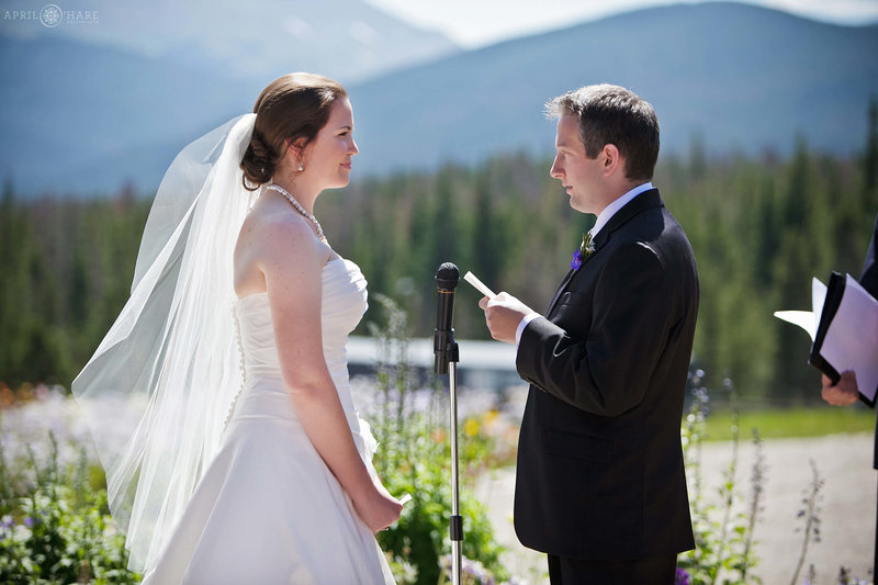 Bride and Groom say their views on a bright sunny day at Ten Mile Station at Breckenridge Ski Resort in Colorado