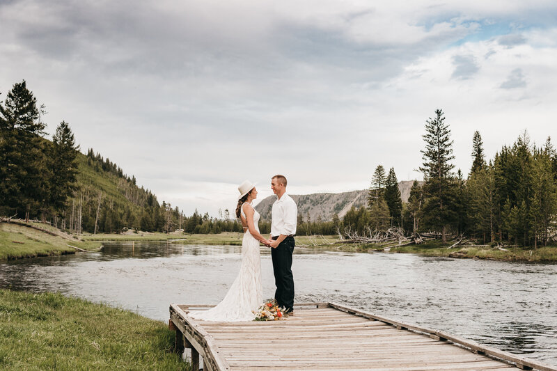 Tyler and Brittney share vows at the end of the bridge during their Yellowstone Elopement
