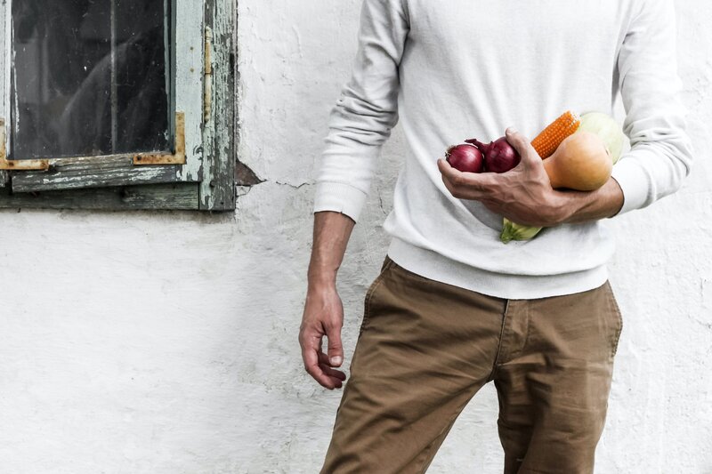 Man holding a fruits and vegetables.
