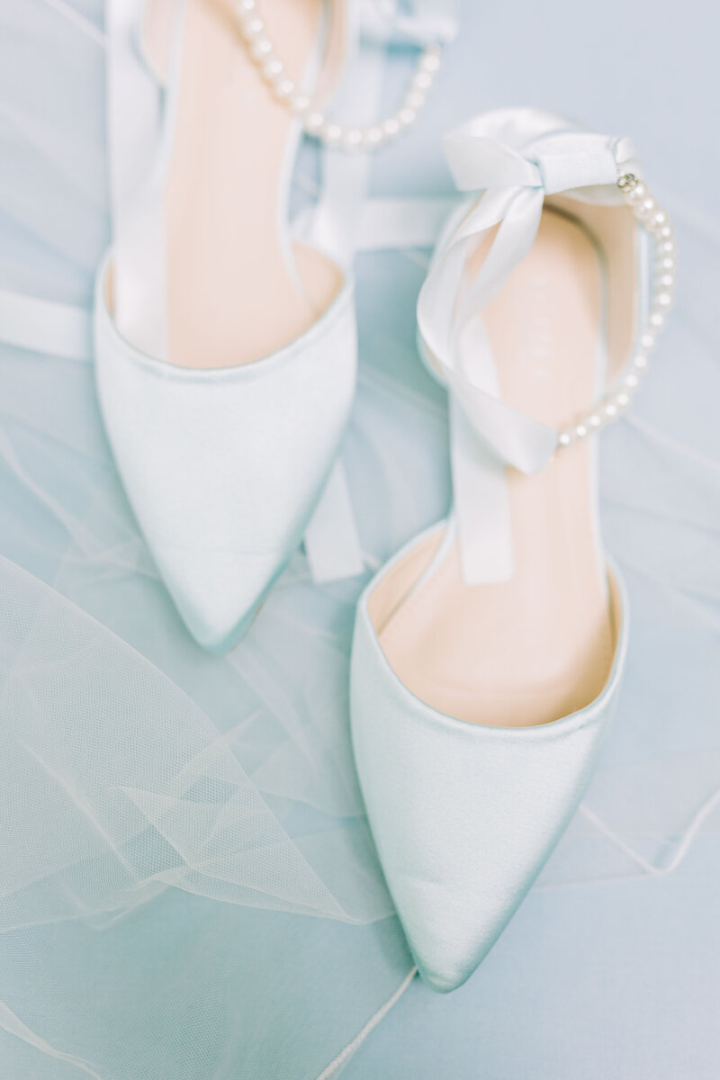 Close up detail shot of blue bridal flats with pearl and satin detail Winx Photo, knoxville wedding photographer