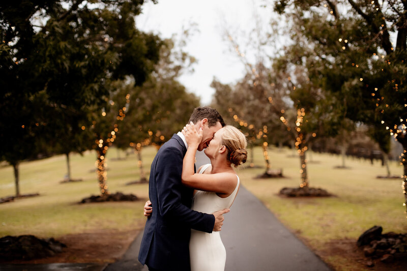 Bride and Groom passionately kissing and holding each other