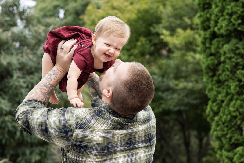Dad holding daughter up Hendersonville NC family photographer