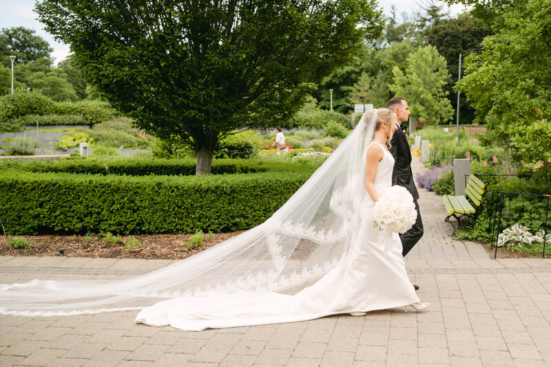 bride and groom walking hand in hand