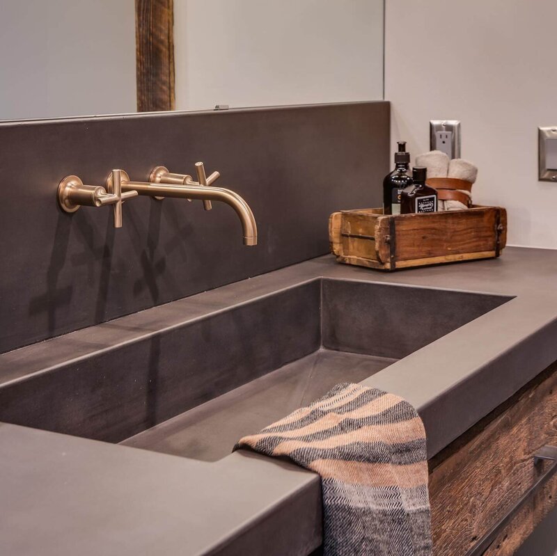 concrete trough sink in rustic bathroom with reclaimed wood vanity